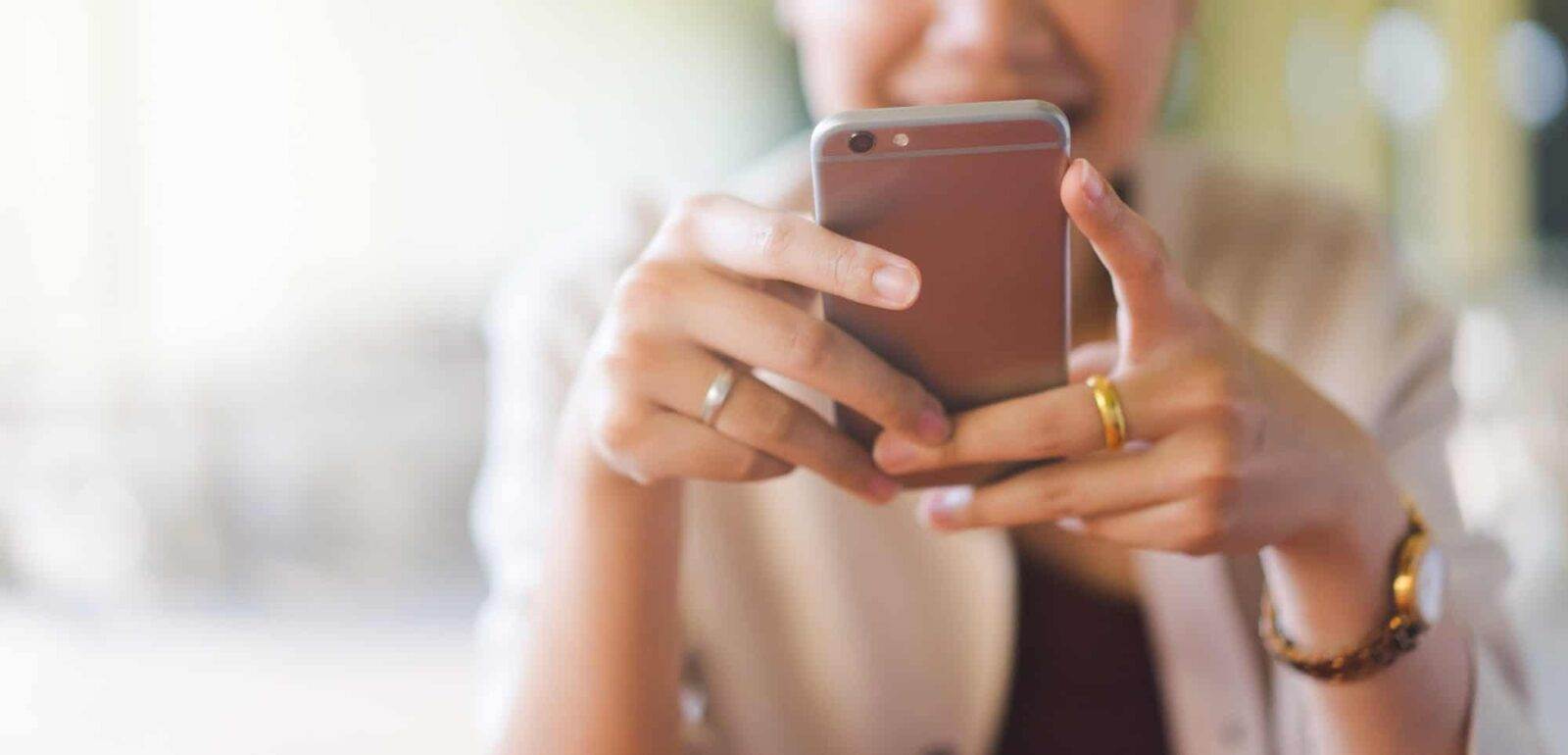 woman using social media phone