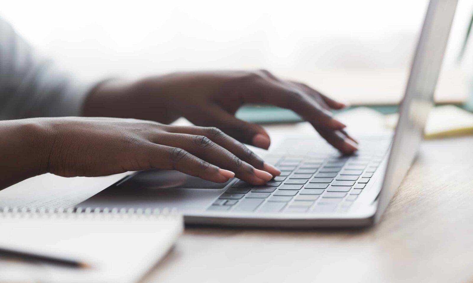 Person typing on a laptop