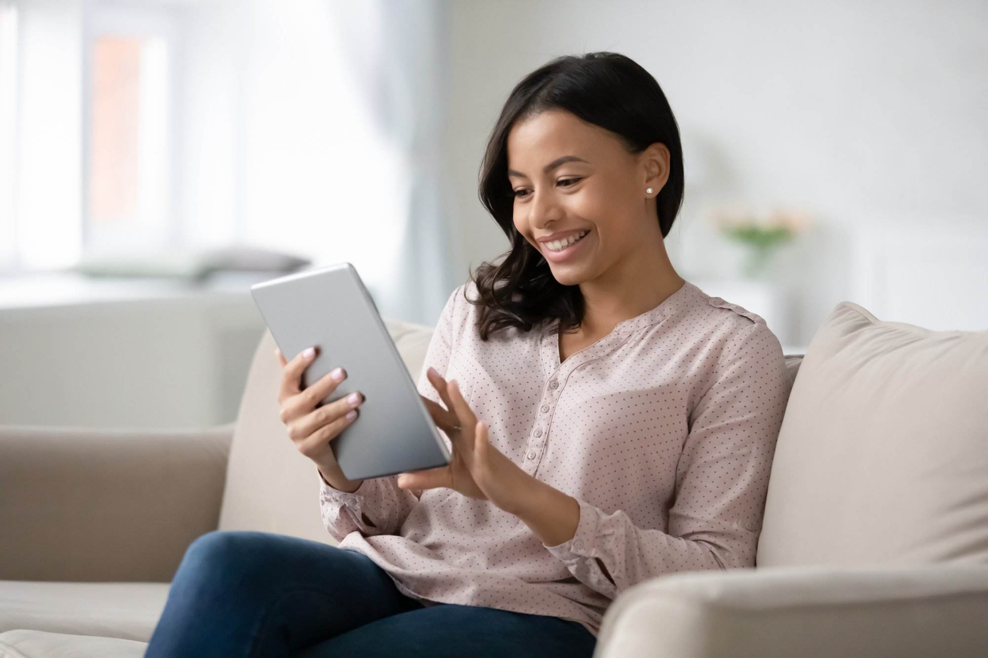 Woman using tablet to learn about Featured Snippets