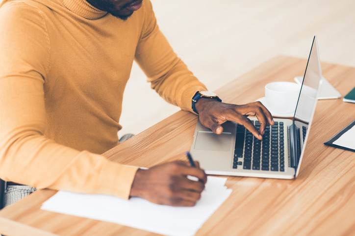 content writing - man typing on his laptop