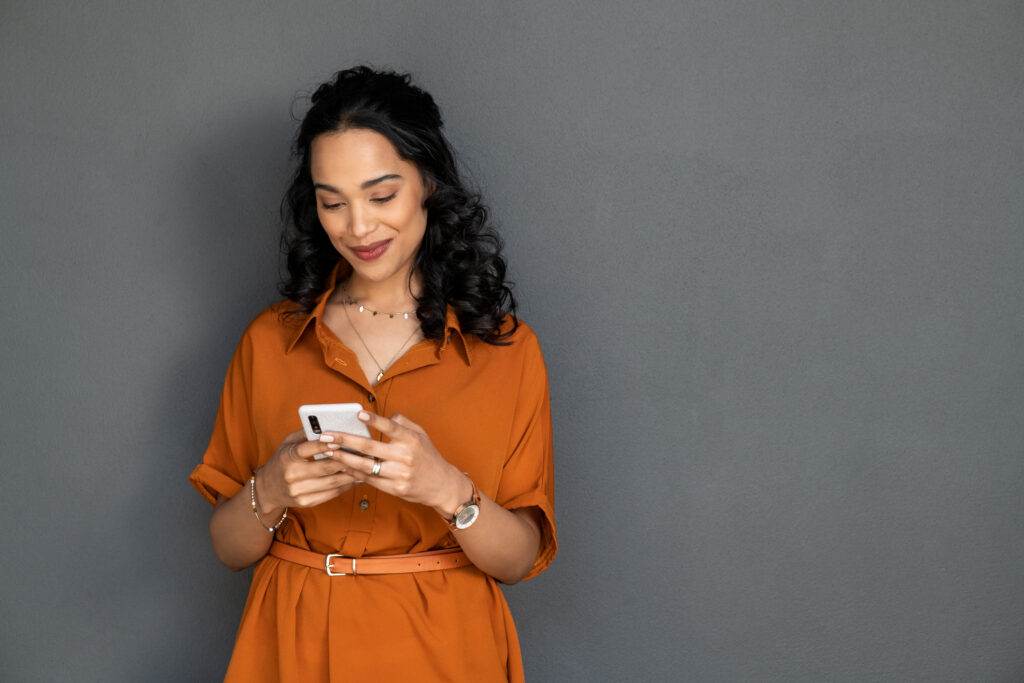 Woman using a phone to browse social media.